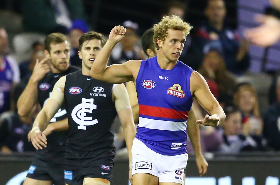 AFL 2016 Rd 04 - Carlton v Western Bulldogs MELBOURNE, AUSTRALIA - APRIL 16: Mitch Wallis of the Bulldogs celebrates after kicking a goal during the 2016 AFL Round 04 match between the Carlton Blues and the Western Bulldogs at Etihad Stadium, Melbourne on April 16, 2016. (Photo by Scott Barbour/AFL Media)